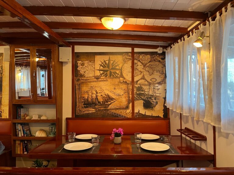 mini cruiser elena adriatic charter miles dining table view